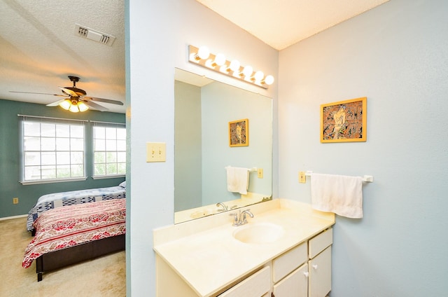 6211 Ludington Dr Unit 21-909, Houston, TX 77035 - bathroom featuring a ceiling fan and vanity