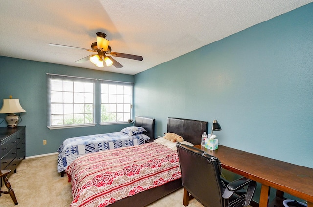 6211 Ludington Dr Unit 21-909, Houston, TX 77035 - carpeted bedroom featuring ceiling fan, baseboards, and a textured ceiling