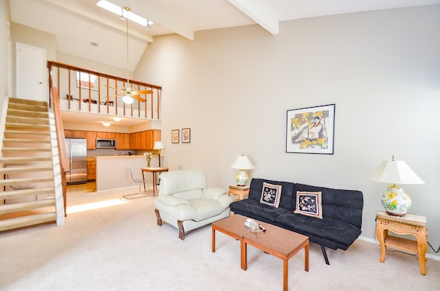 6211 Ludington Dr Unit 21-909, Houston, TX 77035 - living room featuring light colored carpet, beamed ceiling, stairs, high vaulted ceiling, and a ceiling fan