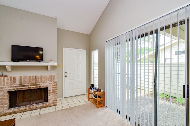 6211 Ludington Dr Unit 21-909, Houston, TX 77035 - living room with lofted ceiling, carpet flooring, and a fireplace