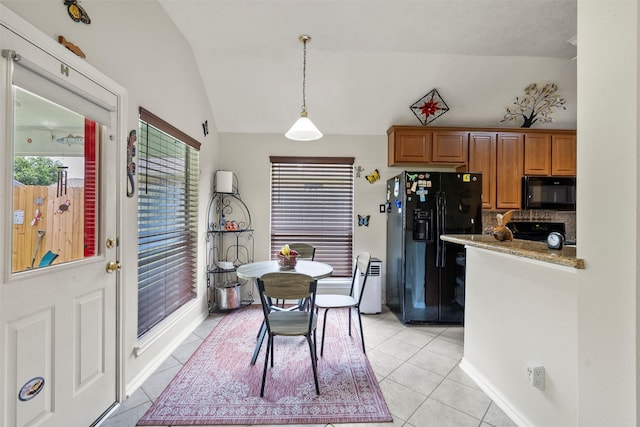 411 Ceole Ln, League City, TX 77573 - dining area featuring lofted ceiling and light tile patterned floors