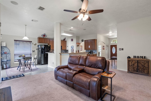 411 Ceole Ln, League City, TX 77573 - living area with a ceiling fan, light colored carpet, baseboards, and arched walkways
