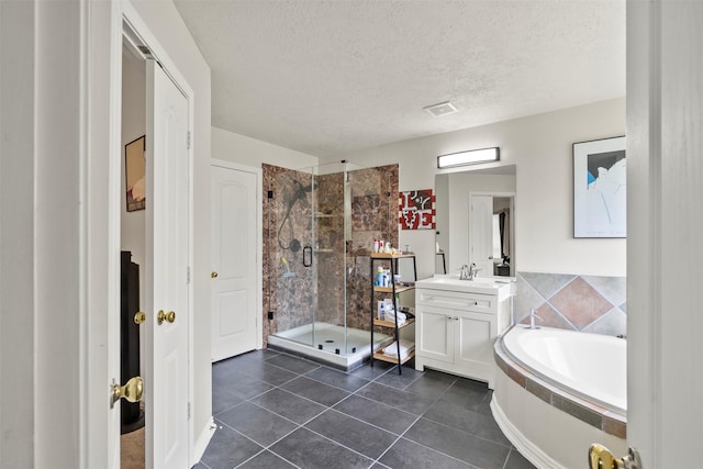 411 Ceole Ln, League City, TX 77573 - bathroom featuring a shower stall, a garden tub, vanity, a textured ceiling, and tile patterned floors