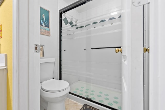 411 Ceole Ln, League City, TX 77573 - full bath featuring a shower stall, toilet, and tile patterned floors