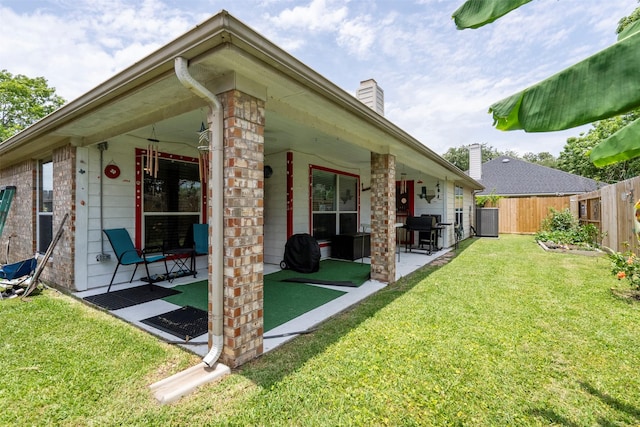 411 Ceole Ln, League City, TX 77573 - view of property exterior with a patio, a chimney, and brick siding