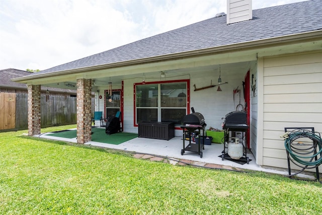 411 Ceole Ln, League City, TX 77573 - rear view of property with roof with shingles, a patio area, and a chimney