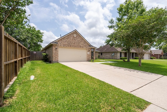 411 Ceole Ln, League City, TX 77573 - view of front of property with brick siding, concrete driveway, and an attached garage
