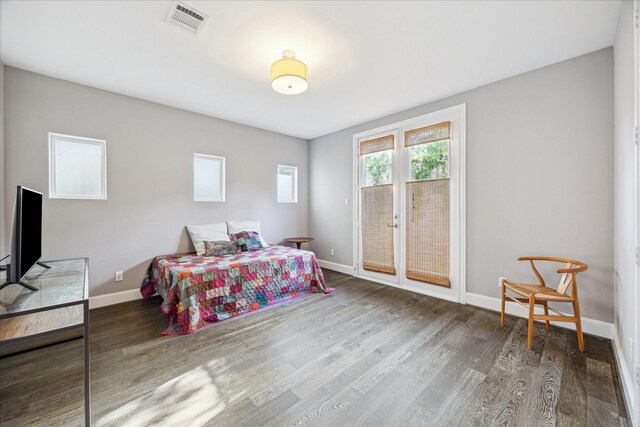 612 E 20th St Unit B, Houston, TX 77008 - bedroom featuring access to exterior, wood finished floors, and baseboards