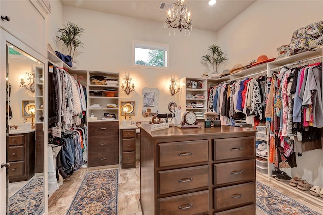 12431 Lake Vista Dr, Willis, TX 77318 - spacious closet featuring a chandelier