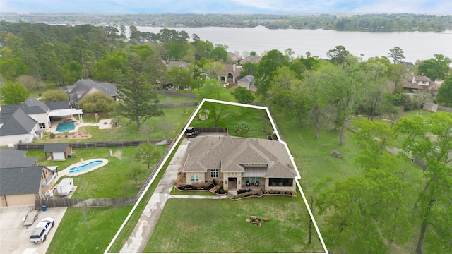 12431 Lake Vista Dr, Willis, TX 77318 - aerial perspective of suburban area featuring property parcel outlined and a nearby body of water