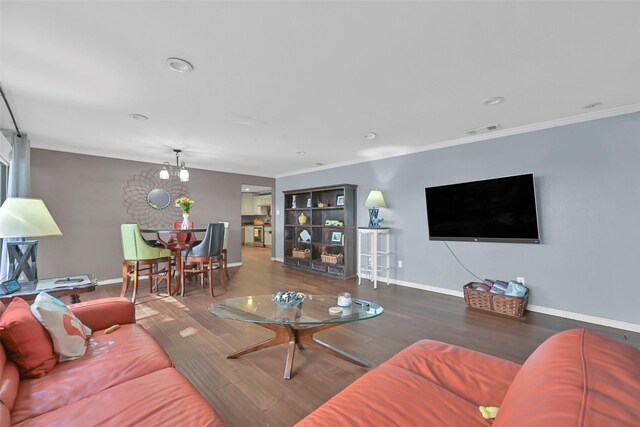 1202 Harbor View Dr, Galveston, TX 77550 - living area with baseboards, wood finished floors, and crown molding