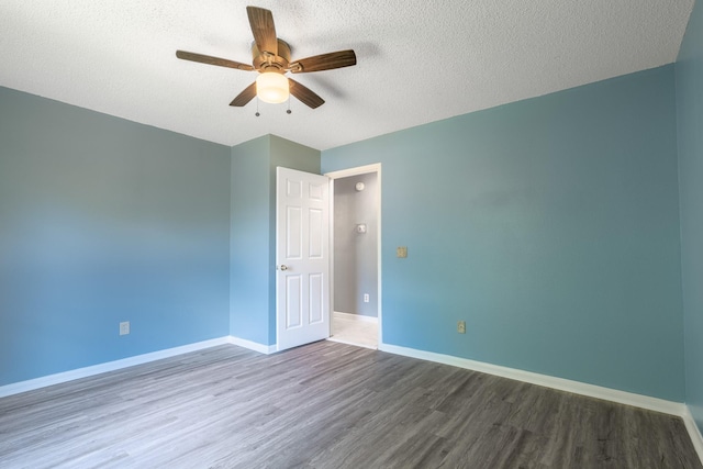 10030 Storm Meadow Dr, Houston, TX 77064 - unfurnished room featuring wood finished floors, ceiling fan, baseboards, and a textured ceiling