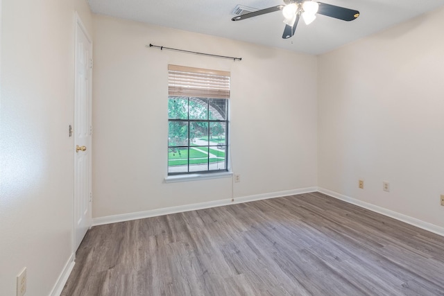 10030 Storm Meadow Dr, Houston, TX 77064 - empty room with wood finished floors, a ceiling fan, and baseboards