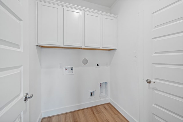15230 Prairie Mill Dr, New Caney, TX 77357 - laundry area featuring hookup for an electric dryer, light wood-type flooring, cabinet space, washer hookup, and hookup for a gas dryer