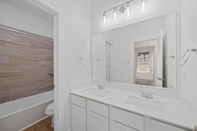 15230 Prairie Mill Dr, New Caney, TX 77357 - bathroom with double vanity,  shower combination, and wood finished floors