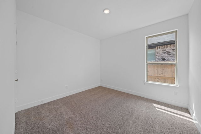15230 Prairie Mill Dr, New Caney, TX 77357 - carpeted empty room featuring baseboards and recessed lighting