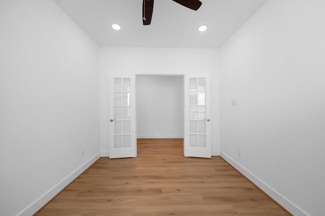 15230 Prairie Mill Dr, New Caney, TX 77357 - unfurnished bedroom with french doors, light wood-type flooring, ceiling fan, and recessed lighting