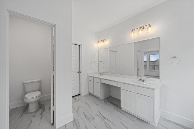 15230 Prairie Mill Dr, New Caney, TX 77357 - bathroom featuring double vanity and marble finish floors