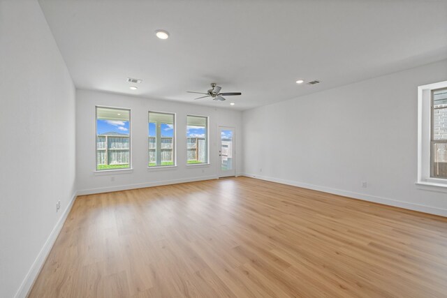 15230 Prairie Mill Dr, New Caney, TX 77357 - unfurnished room featuring light wood-type flooring, ceiling fan, and recessed lighting