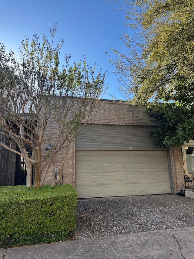 10 S Briar Hollow Ln Unit 15, Houston, TX 77027 - garage featuring driveway