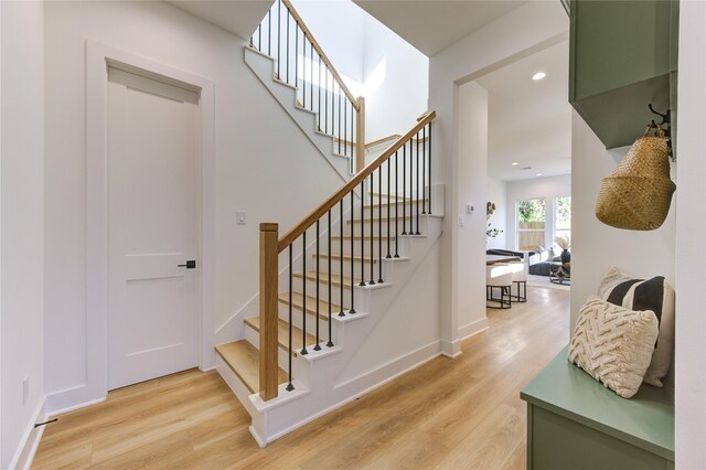 5415 Arapahoe St, Houston, TX 77020 - stairs with wood finished floors, baseboards, and recessed lighting