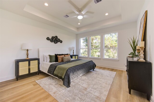 5415 Arapahoe St, Houston, TX 77020 - bedroom with a raised ceiling, light wood-type flooring, baseboards, recessed lighting, and ceiling fan