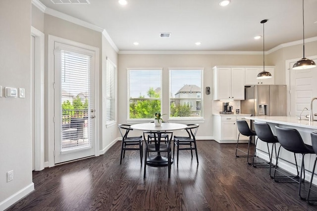 10603 Centre Green Way, Houston, TX 77043 - dining space featuring dark wood finished floors, baseboards, crown molding, and recessed lighting