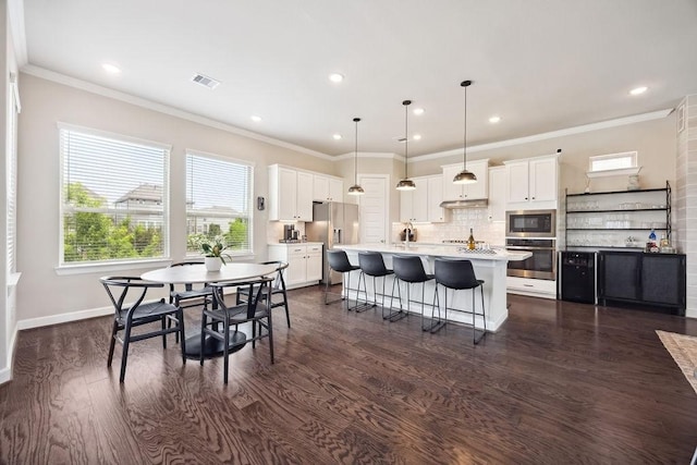 10603 Centre Green Way, Houston, TX 77043 - dining room featuring ornamental molding, dark wood-style flooring, recessed lighting, and baseboards