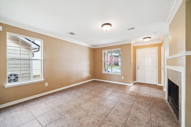 10010 Victoria Falls Ln, Houston, TX 77075 - tiled spare room featuring ornamental molding, a fireplace, and baseboards
