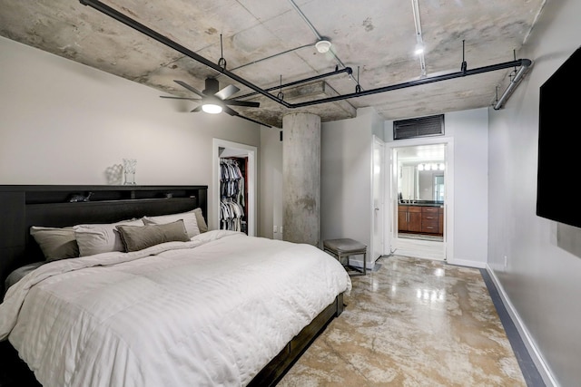 2000 Bagby St Unit 5426, Houston, TX 77002 - bedroom featuring baseboards, finished concrete floors, a walk in closet, connected bathroom, and a closet