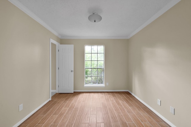 1614 Sweet Grass Trl, Houston, TX 77090 - unfurnished room featuring baseboards, ornamental molding, wood finished floors, and a textured ceiling