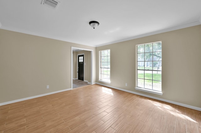 1614 Sweet Grass Trl, Houston, TX 77090 - empty room with ornamental molding, plenty of natural light, baseboards, and light wood finished floors
