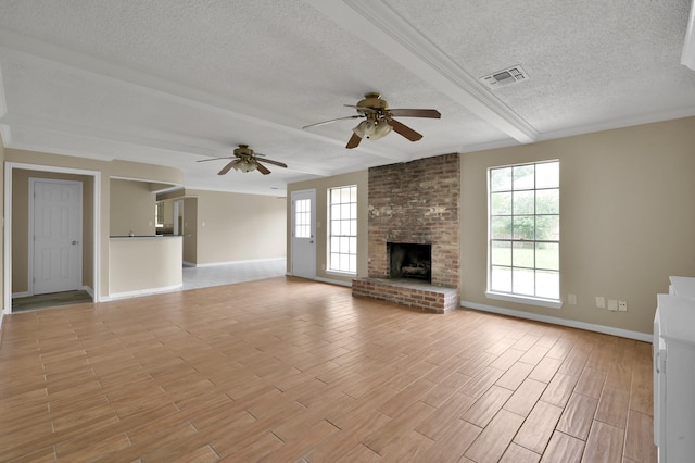 1614 Sweet Grass Trl, Houston, TX 77090 - unfurnished living room featuring a textured ceiling, baseboards, a ceiling fan, light wood-style flooring, and a fireplace