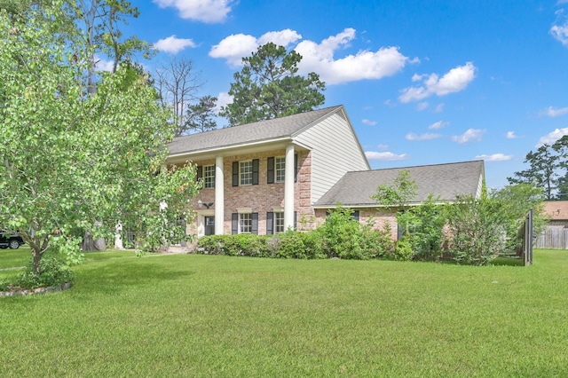 1614 Sweet Grass Trl, Houston, TX 77090 - greek revival inspired property featuring a front yard, brick siding, and roof with shingles