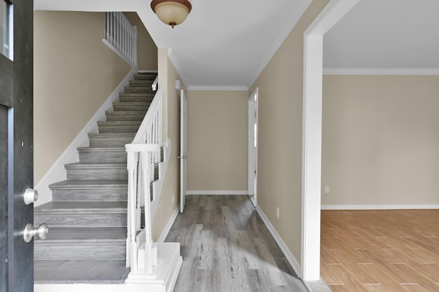 1614 Sweet Grass Trl, Houston, TX 77090 - foyer featuring wood finished floors, stairs, baseboards, and ornamental molding