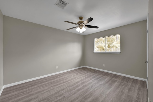 1614 Sweet Grass Trl, Houston, TX 77090 - empty room featuring wood finished floors, baseboards, and ceiling fan