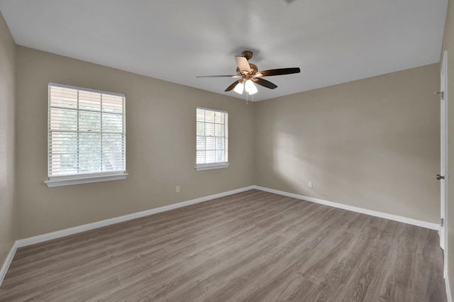 1614 Sweet Grass Trl, Houston, TX 77090 - unfurnished room with wood finished floors, a ceiling fan, and baseboards