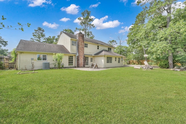 1614 Sweet Grass Trl, Houston, TX 77090 - back of property featuring a patio, a chimney, and central AC