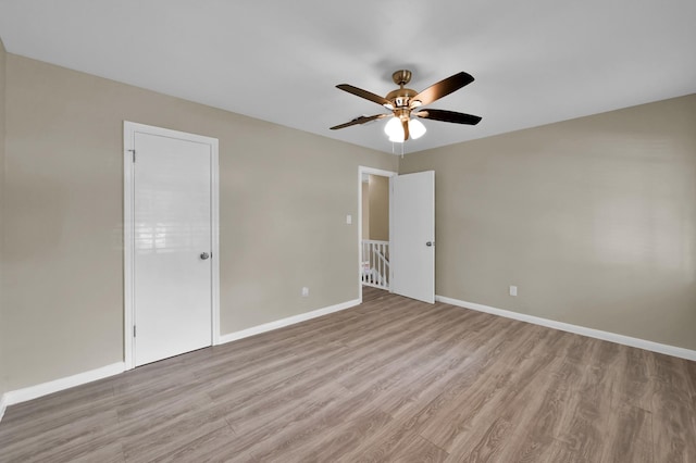 1614 Sweet Grass Trl, Houston, TX 77090 - spare room with light wood finished floors, ceiling fan, and baseboards