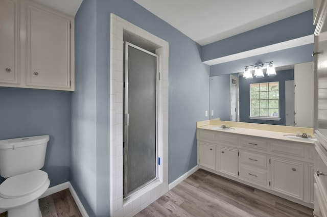 1614 Sweet Grass Trl, Houston, TX 77090 - full bathroom with double vanity, a stall shower, toilet, and baseboards