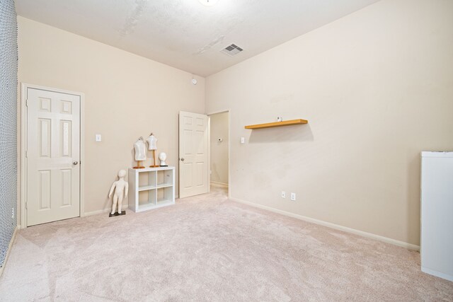 28523 Kinglet Pines Dr, Katy, TX 77494 - spare room featuring carpet, baseboards, and high vaulted ceiling