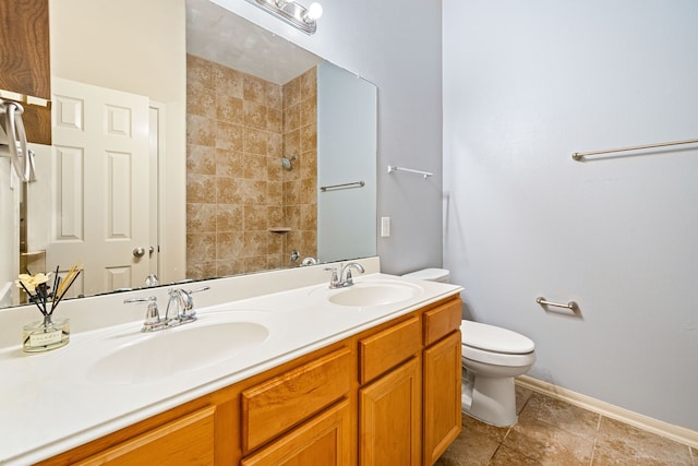 28523 Kinglet Pines Dr, Katy, TX 77494 - bathroom with toilet, baseboards, double vanity, a shower, and tile patterned flooring