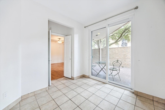 5210 Weslayan St Unit 112, Houston, TX 77005 - unfurnished room featuring baseboards, light tile patterned floors, and a ceiling fan