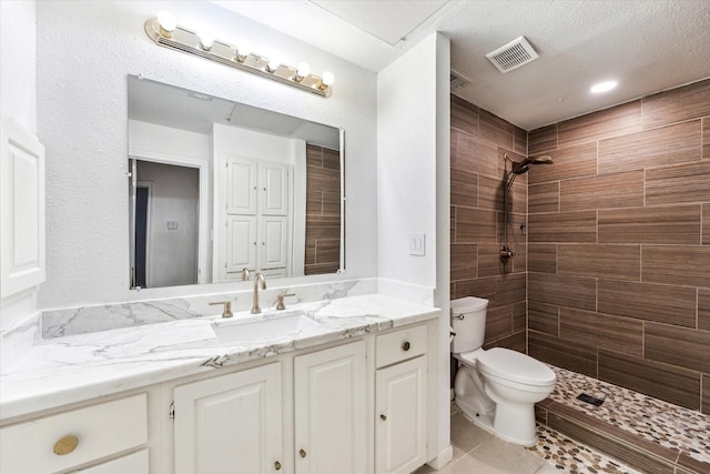 5210 Weslayan St Unit 112, Houston, TX 77005 - full bath with toilet, a tile shower, tile patterned floors, and vanity