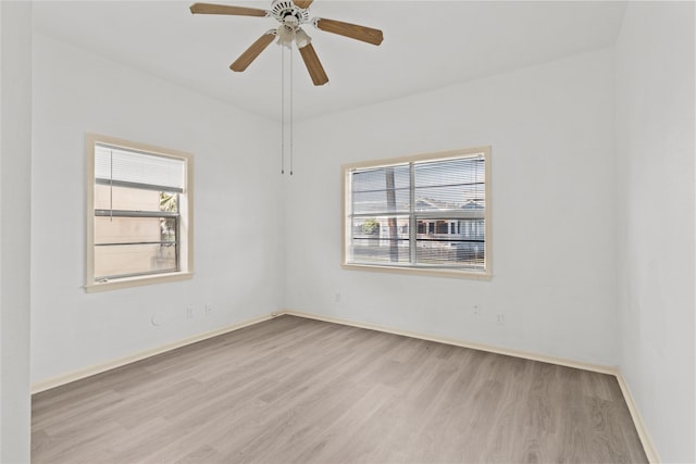 1522 Seawall Blvd, Galveston, TX 77550 - empty room featuring wood finished floors, healthy amount of natural light, and ceiling fan