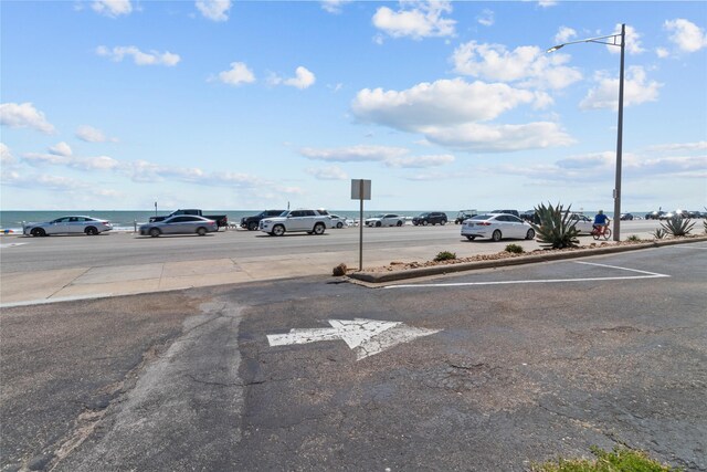 1522 Seawall Blvd, Galveston, TX 77550 - uncovered parking lot with a water view