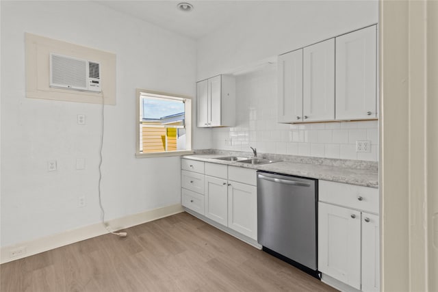 1522 Seawall Blvd, Galveston, TX 77550 - kitchen featuring dishwasher, light wood-style floors, light countertops, and white cabinets