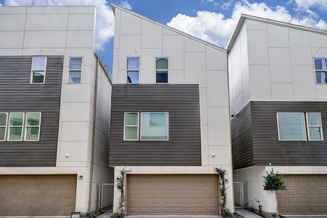 1203 Hickory St Unit D, Houston, TX 77007 - view of front of house featuring a garage and stucco siding