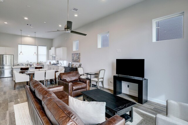 1203 Hickory St Unit D, Houston, TX 77007 - living area featuring recessed lighting, light wood-style flooring, a ceiling fan, and baseboards