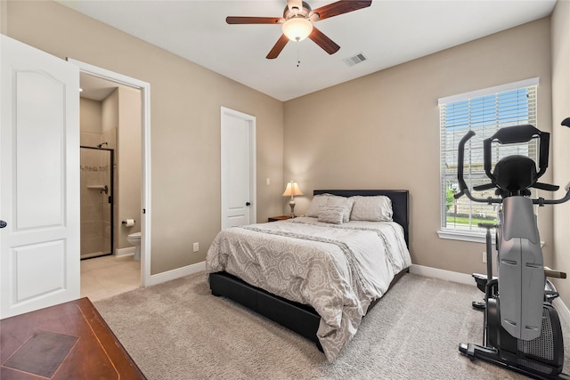 27710 Bering Crossing Dr, Katy, TX 77494 - bedroom with carpet floors, baseboards, ensuite bathroom, and ceiling fan